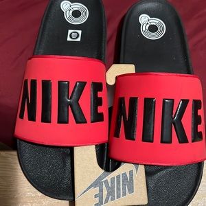 Red Nike slides brand new tags on